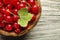 Redcurrant berries in bowl close up