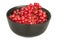 Redcurrants in a black bowl on a white background close up