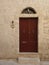 Reddish brown wood door in Malta