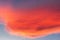 Reddish clouds at sunset over mountains