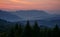 Reddish sky at dawn in mountains