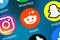 Reddit logo social media icon marketing network on the internet background