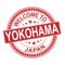 Redgrunge rubber stamp with the name of Yokohama city from Japan