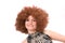 Redhaired beauty with afro wig