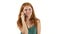 Redhaired girl talking on the phone. White background