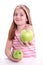 Redhaired girl with two green apple,on white background