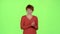 Redhaired woman in the theater claps and she does not like the actors` play. Green screen