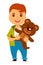 Redhead boy with freckles holds soft teddy bear