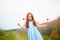 Redhead cute girl outdoors. Beautiful stylish romantic young girl with poppies