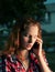 Redhead girl calling by mobile phone