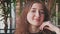 Redhead girl headshot smiling in modern cafeteria