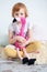 Redhead girl hugging a plush toy flamingo