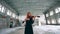 Redhead lady is playing the violin in an abandoned building