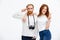 Redhead photographer dressed in white jacket standing near redhe