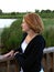 Redhead woman on bridge