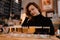 Redhead woman does a degustation of a variety of light and dark czech beer in a bar pub