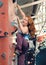 Redhead Woman Indoor Rock Climbing. Strong Female Climber