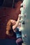 Redhead Woman Indoor Rock Climbing. Strong Heroic Female Climber