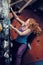 Redhead Woman Indoor Rock Climbing. Strong Heroic Female Freeclimbing