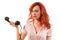 Redhead woman with a retro look speaking at a vintage phone