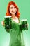 Redhead woman with two huge green beers