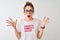 Redhead woman wearing funny t-shirt with irony comments over  white background very happy and excited, winner expression
