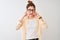 Redhead woman wearing striped shirt and glasses standing over isolated white background covering ears with fingers with annoyed