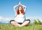 Redhead yoga woman in meditation pose