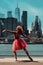 redhead young girl posing at city street Downtown Brooklyn, New York city financial district cityscape