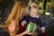 Redheaded Mother and Baby with Christmas Gift