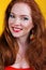 Redheaded smiling girl with fashion makeup
