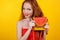 Redheaded smiling girl with orange purse