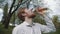 Redheaded young man with a beard drinking water from bottle. Cold drink summer day outdoor. Young fit man drinking water