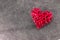 Redheart-shaped straw weave on a gray textured background