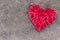 Redheart-shaped straw weave on a gray textured background