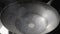 A redhot cast iron wok frying pan is smoking and heating up on stove close up. Empty frying pan on stove. The pan is