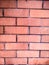 Redly brick is laid in a decorative style texture and background