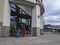 Redmond, WA USA - circa March 2021: Low angle view of a corner entrance to a Trader Joe`s grocery store in the downtown area