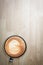 Redolent cappuccino coffee on wooden table. Selective focus.