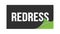 REDRESS text written on black green sticker