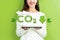 Reduce CO2 with woman holding a tablet