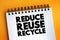 Reduce Reuse Recycle text on notepad, concept background