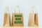 Reduce reuse recycle text on plain paper bags. Packages delivery and sale