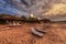 Reed parasols on clouded beach