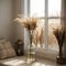 Reed plume stem, vase with dry flower on window, dried pampas grass. Decorative flower arrangement in home interior, trendy home d