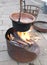 reenactment with bonfires and an old cauldron with boiling water