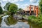 Reeuwijk, South Holland, The Netherlands - Restaurant and terrace with small boat reflecting in the canal