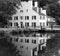 Refection in water of old, historic building in B&W