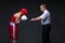 Referee checking young boxer