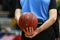 A referee holds the official Eurocup game ball during a Eurocup basketball match